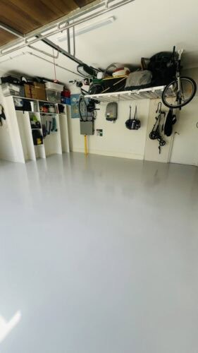Well-organised garage with tools, bikes, and storage solutions for a tidy space.