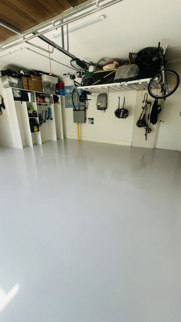 Well-organised garage with tools, bikes, and storage solutions for a tidy space.
