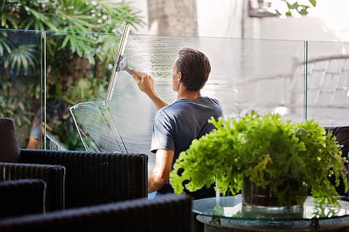 cleaning windows using a squeegee