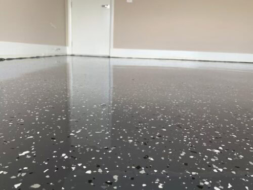 Epoxy coated garage floor with speckled finish, durable and stylish for Australian homes.